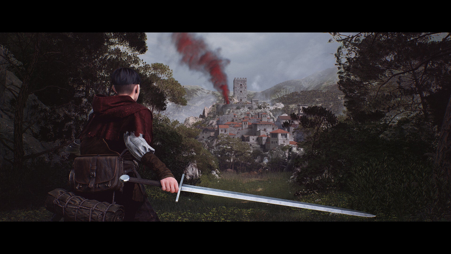 Character with a sword looking at a smoldering village from a distance