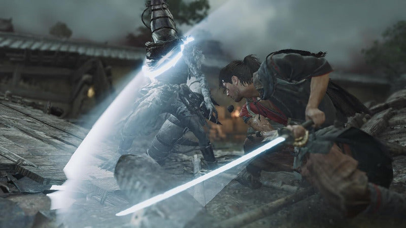 A dramatic action scene showing two armored figures in combat with glowing blue swords in a ruined outdoor setting.