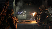 A dramatic sci-fi action scene showing two heavily armored soldiers aiming weapons toward a central figure in a smoky industrial interior, with bright muzzle flashes and glowing orange light.