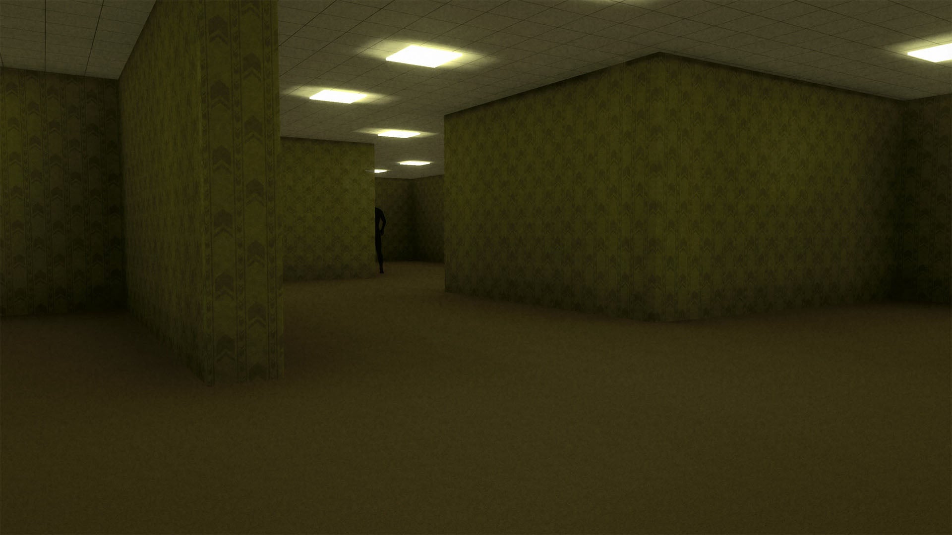 A dark, empty room with dim overhead lights, patterned wallpaper, and a small dark figure standing in the distance.