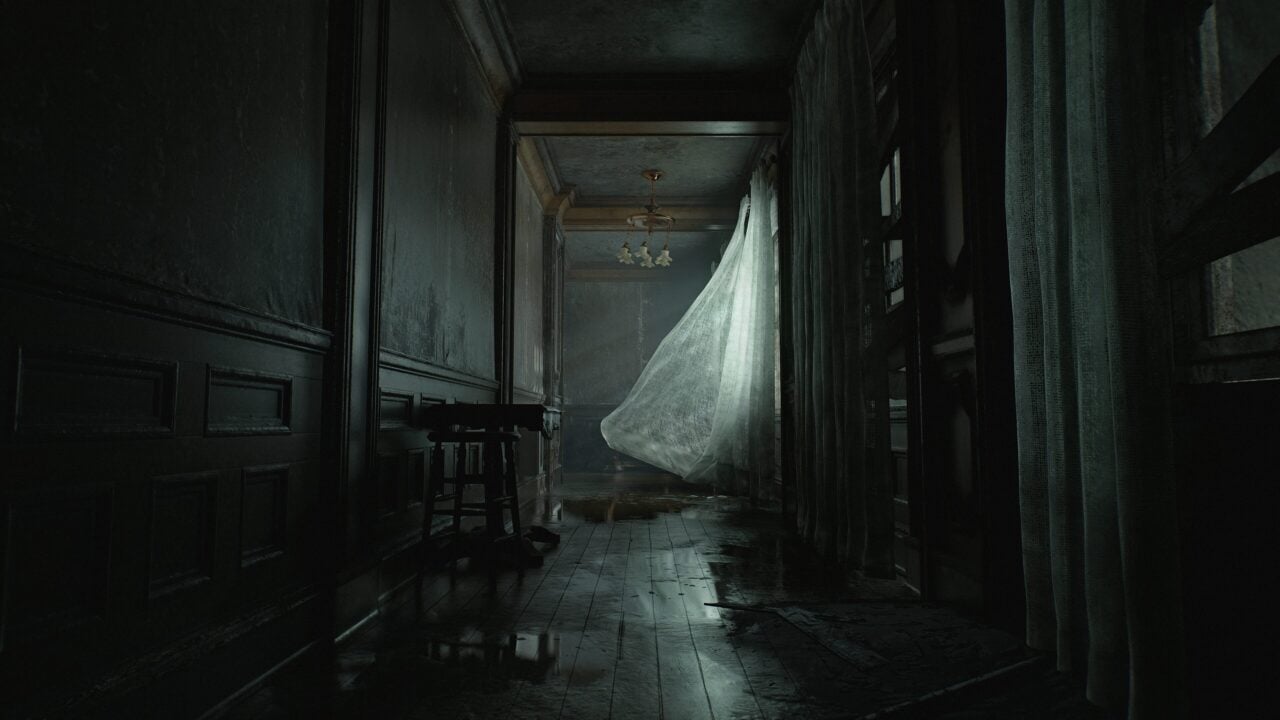 Dark, eerie hallway with a draped sheet hanging from an open door