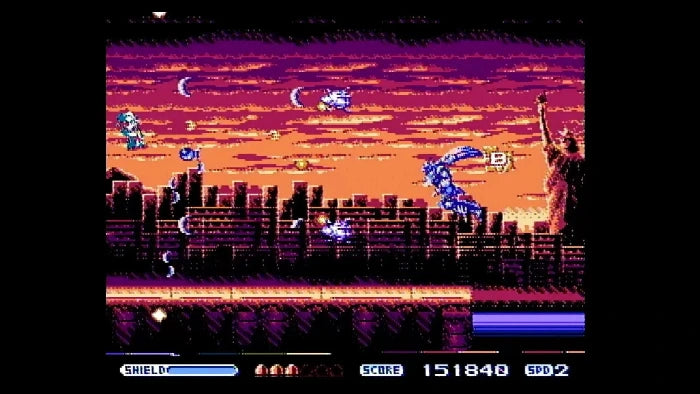 Pixel art screenshot from a retro video game showing a blue character fighting in front of a city skyline and Statue of Liberty against a purple and orange sunset sky. Game UI elements including shield, health, score, and SPD2 are visible at the bottom.