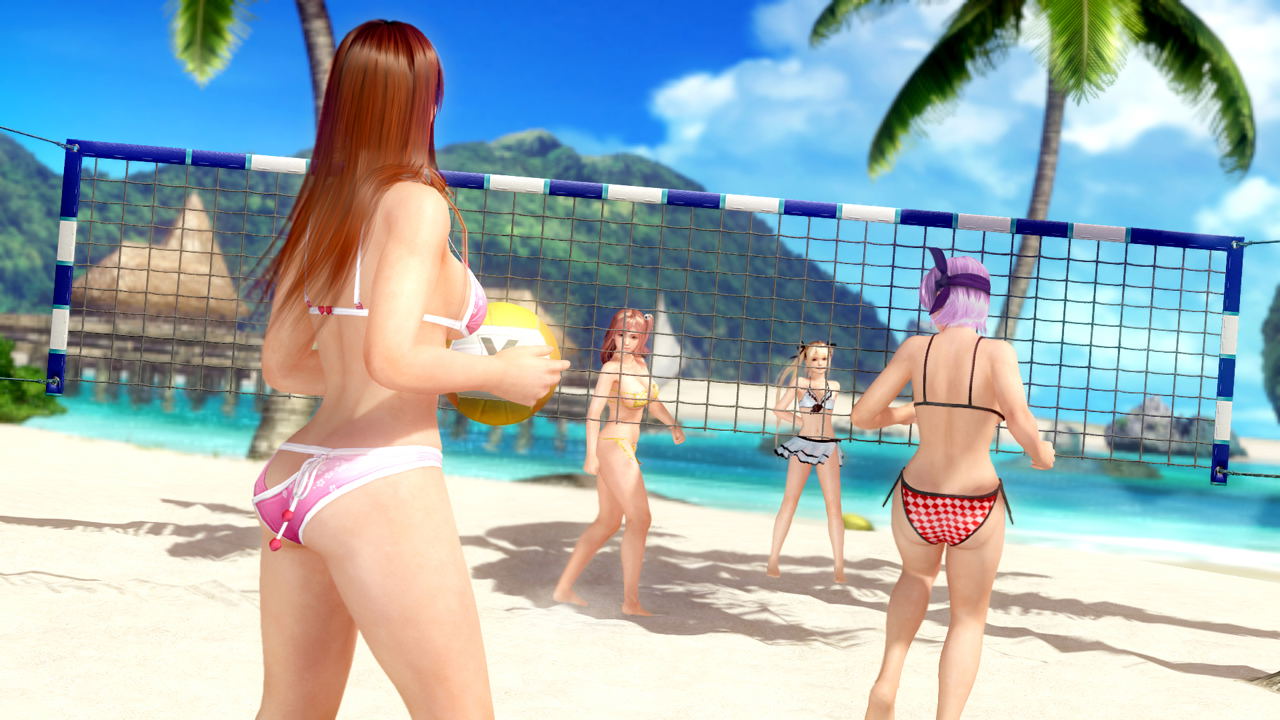 People playing beach volleyball on a tropical beach with palm trees and mountains in the background.
