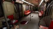 Deserted subway car with red seats and scattered items on the floor