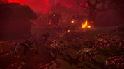 Dark and eerie landscape with glowing fires and creatures in a red-tinted setting