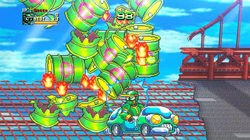 A colorful pixel-art scene showing a green character in a blue race car on a bridge-like platform, facing a giant stack of green barrels with pink and yellow accents. The background is a bright blue sky, and the scene has a retro video game HUD in the top left.