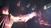 A dramatic scene showing a person in a dark cloak extending their arm toward glowing floating energy effects in a dim, atmospheric environment.
