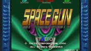 Vintage video game screen with 'Space Gun' title and Taito logo, featuring a retro design.