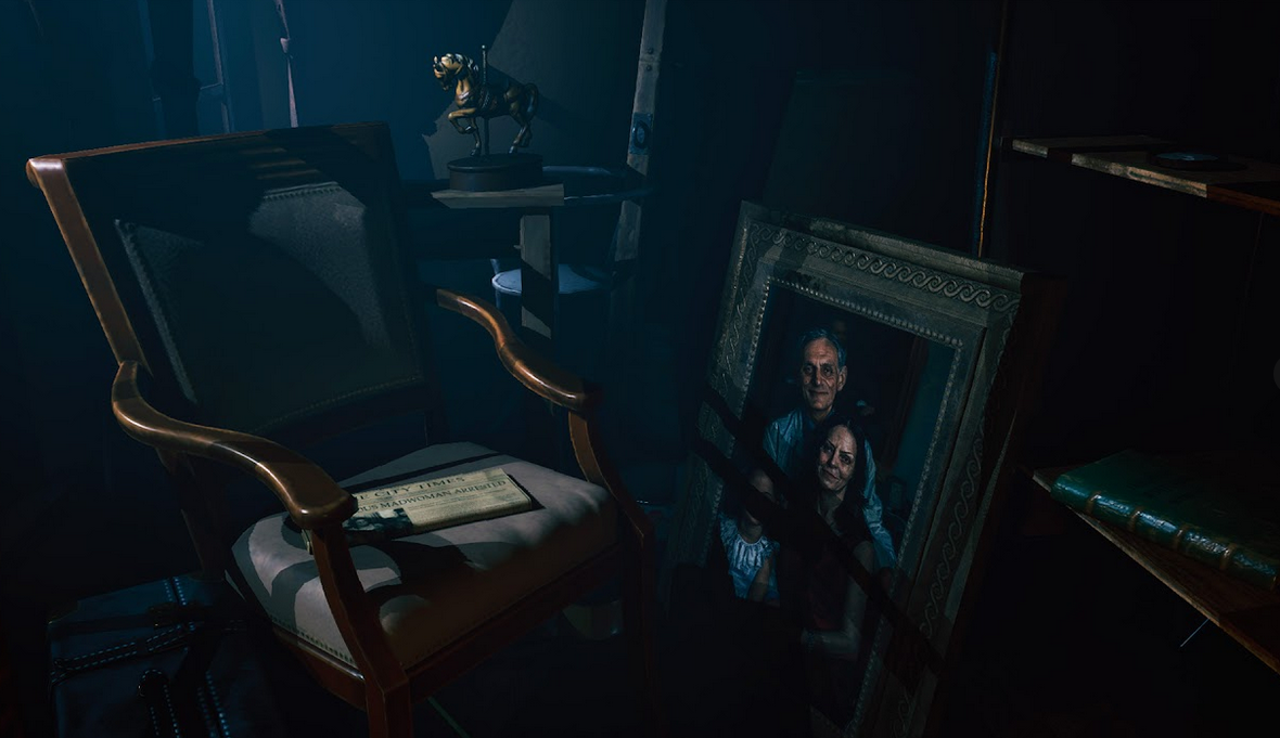 Dark room with a chair, table, and framed picture of a man holding a gun.