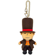 A small plush character keychain or bag charm with a tan face, wearing a tall brown top hat with a red band, a brown coat, and an orange shirt, attached to a gold chain on a plain white background.