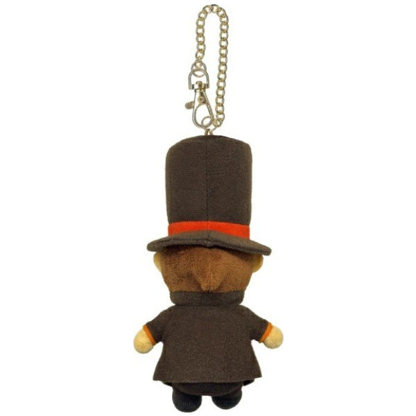 A small plush character keychain shown from the back, wearing a dark brown top hat with a bright orange-red band and a dark brown coat, attached to a gold-tone chain on a plain white background.