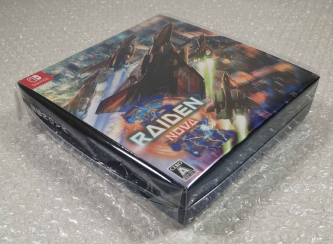 Video game console with 'Raiden' branding on a gray surface