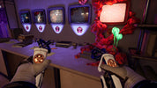 First-person view of a character holding glowing objects in a room with multiple monitors and colorful decorations.