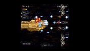 Vintage space shooter game with spaceship and enemy ships on a dark background
