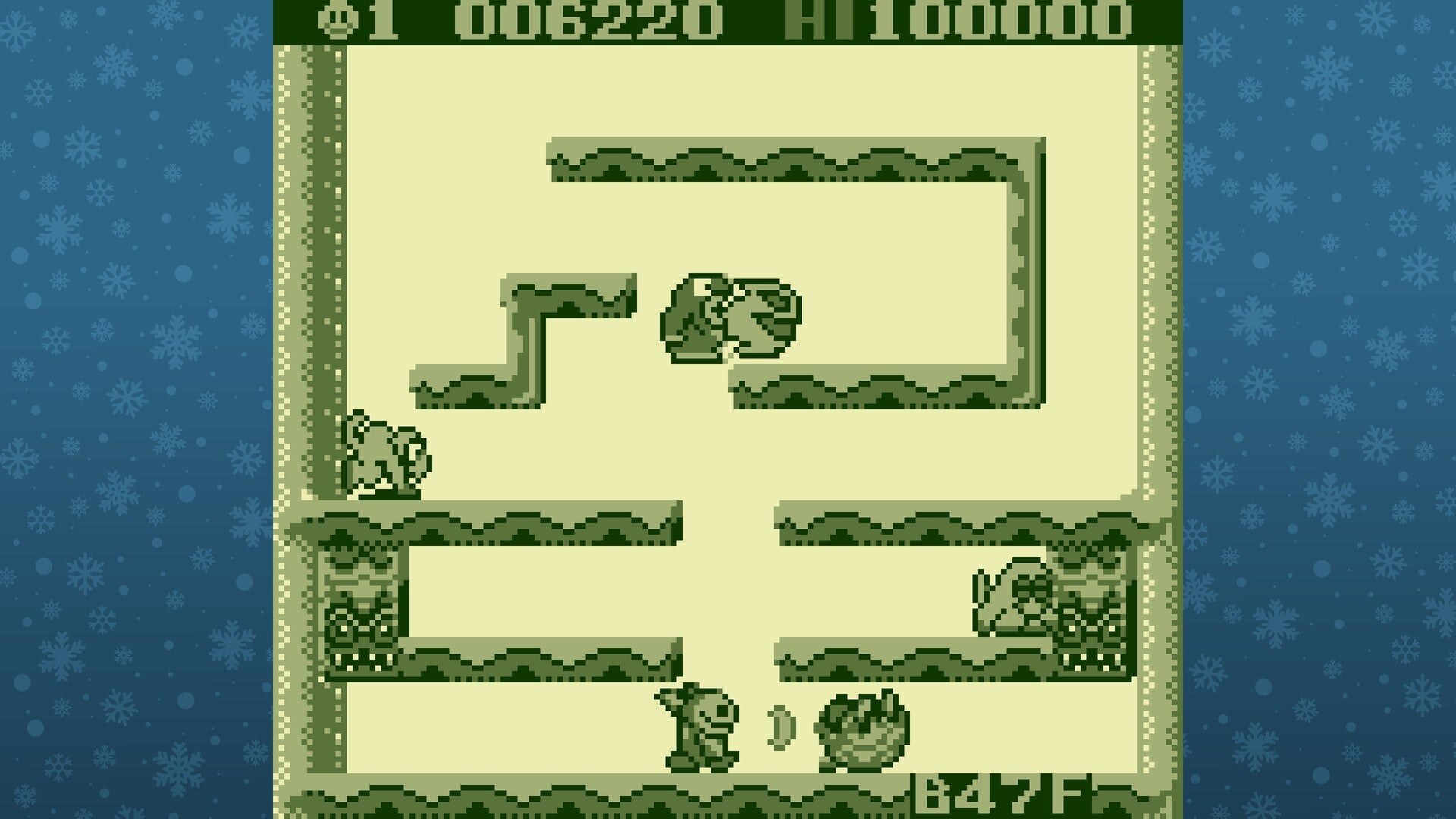 Game screen with a maze-like layout and characters on a blue background with snowflake pattern