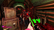 A first-person shooter video game screenshot showing a player holding a red gun with green glowing accents, aiming at two zombie-like enemies in a dark, dilapidated interior hallway. Red blood splatters and a health/pierce indicator are visible on screen.