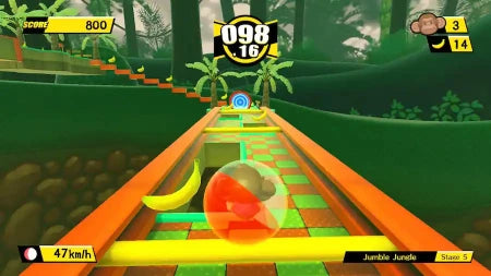 A colorful 3D racing game screenshot showing a spherical orange, red, and green ball racing down a winding track through a jungle-themed environment with banana pieces, scoreboards, and speed information.