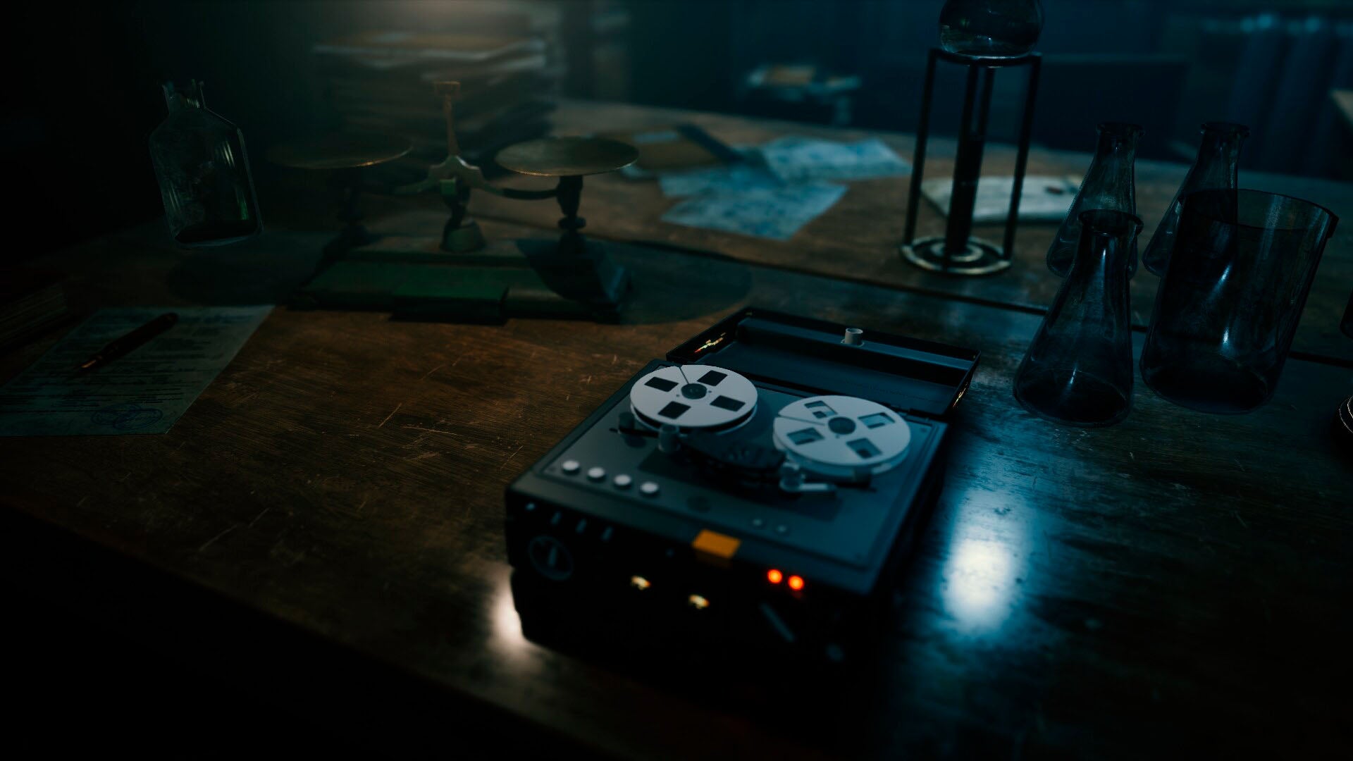 Vintage reel-to-reel tape recorder on a wooden desk with dim lighting