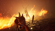 Monster-like creature with horns amidst flames and smoke