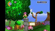 Screenshot of a video game with a character standing on a stone platform, surrounded by trees and creatures.