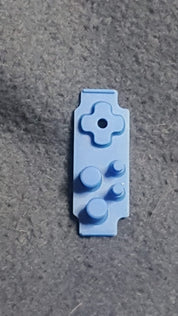 Blue plastic component on a gray surface