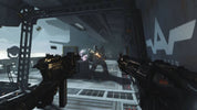 First-person shooter game scene with weapons and character in a futuristic setting