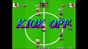 Soccer game screen with players and 'KICK OFF' text on a green field