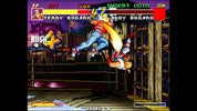 Screenshot of a classic arcade fighting game with two characters in a boxing ring.
