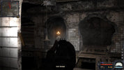 Dark, eerie interior with a character holding a weapon and a light source.