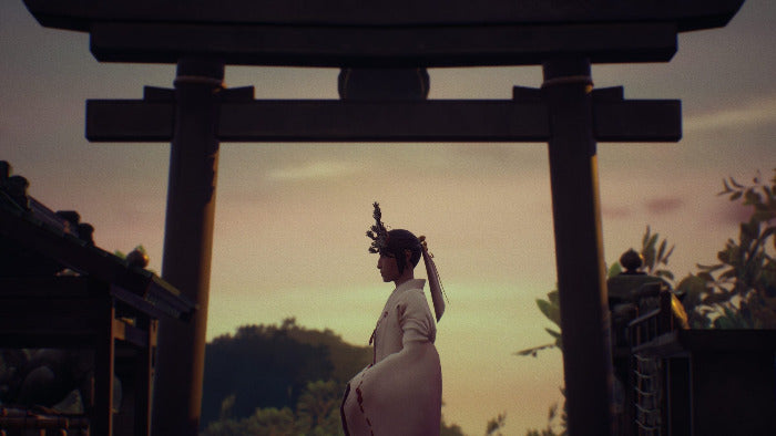 A woman in a white traditional Japanese outfit stands in profile beneath a large dark torii gate at sunset, with a softly glowing sky and outdoor setting in the background.